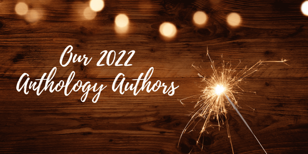 Graphic announcing the 2022 anthology authors. The background is a wooden surface with warm string lights and a lit sparkler on the right side. The text "Our 2022 Anthology Authors" is prominently displayed in a script font.